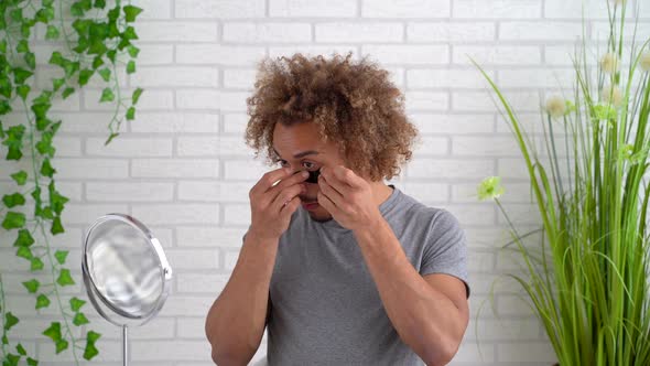 Portrait of young man with eye pad under eye