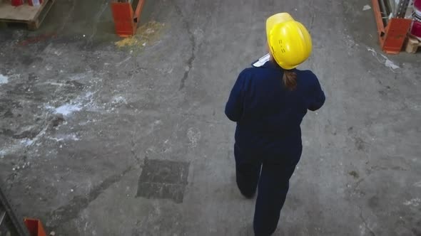 Female Warehouse Inspector Working