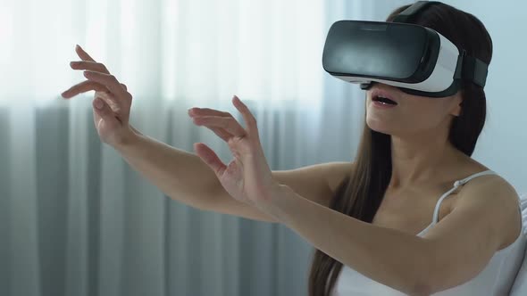 Female in Virtual Reality Headset Playing Game, Modern Technology, Innovation