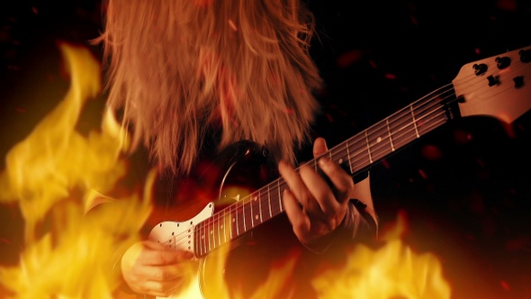 Heavy Metal Guitarist Plays In Raging Fire
