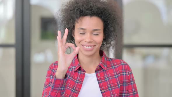 Portrait of African Woman Showing Ok Sign with Finger