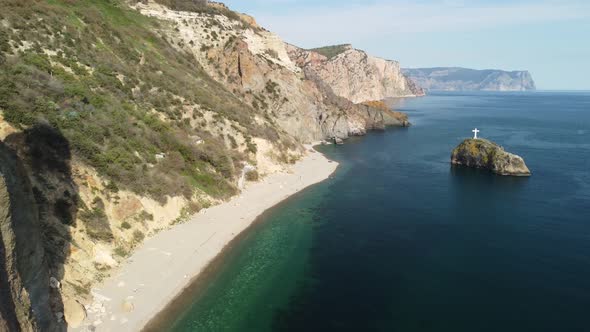 Aerial View on Calm Azure Sea and Volcanic Rocky Shores