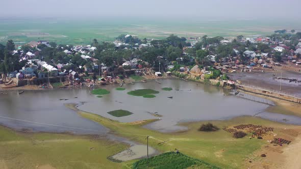 Aerial view of a small residential district with barracks along the swamp, Austagram, Bangladesh.