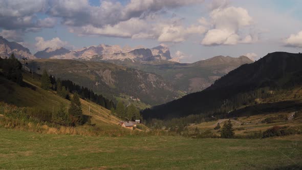 Green mountain valley, serene, harmonious Alps panorama, Dolomites, Italy