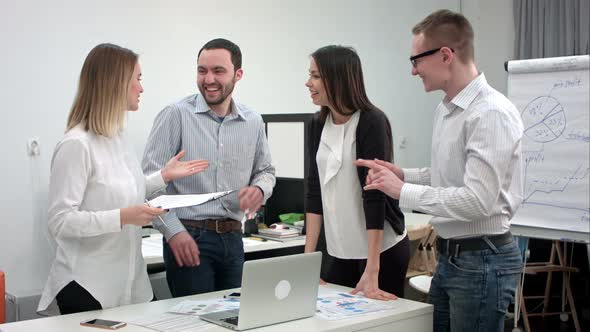 Young Office Workers Having Fun During Business Meeting