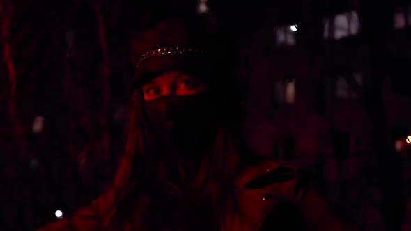 Girl in Black Virus Mask at Night in Red Light Stylish Street Image