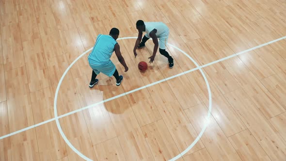 Gym with Two African Ethnicity Basketball Players Having a Practice
