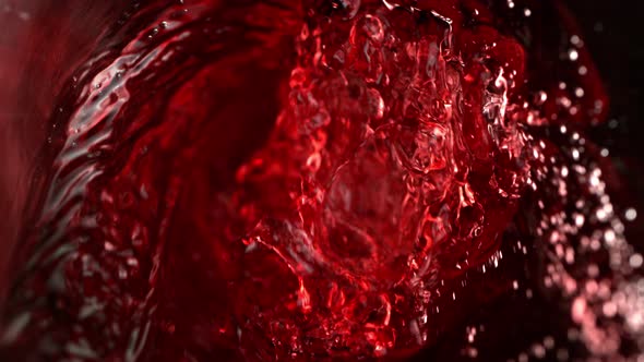 Super Slow Motion Abstract Shot of Red Wine Pouring in Glass Bottle at 1000 Fps.