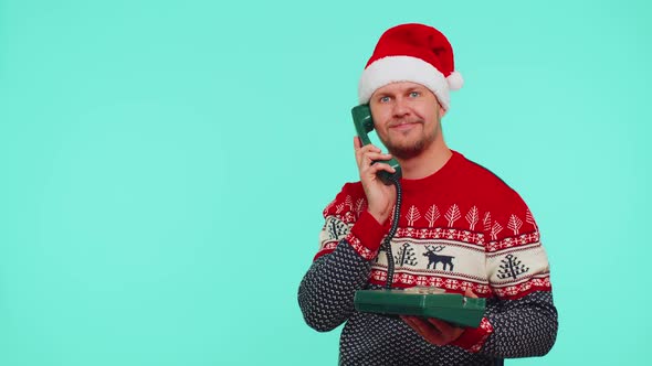 Funny Man in Christmas Sweater Talking on Wired Vintage Telephone of 80s Says Hey you Call Me Back