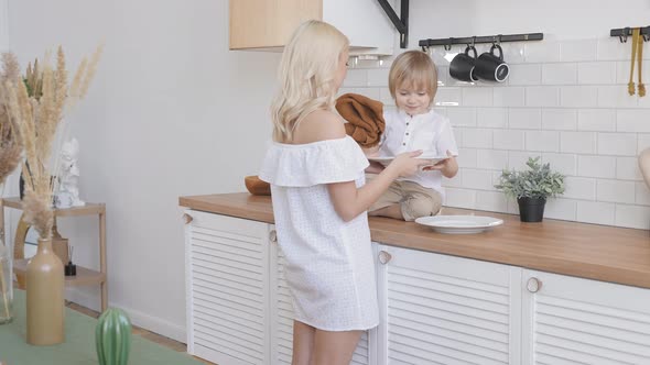 Mom and Son in a Bright Kitchen