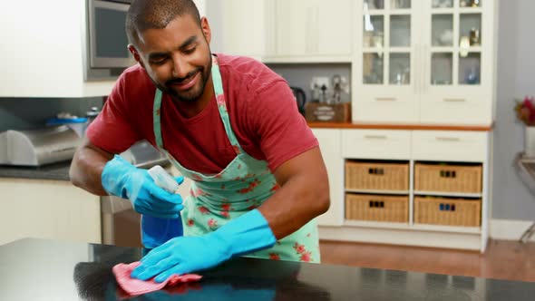 Man cleaning the kitchen worktop 4k