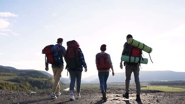 Four Friends Hiking in the Mountains