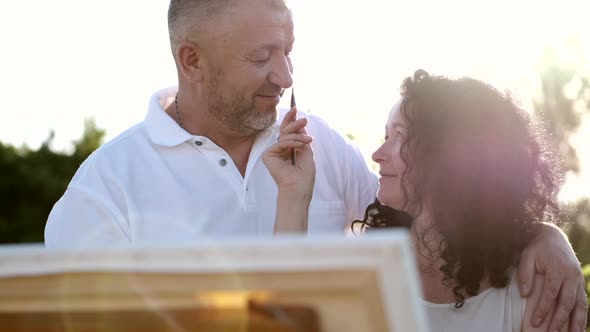 Mature Couple on a Date Painting Together