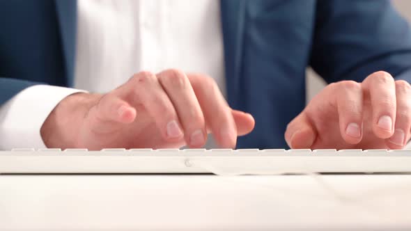 Employee using computer keyboard.