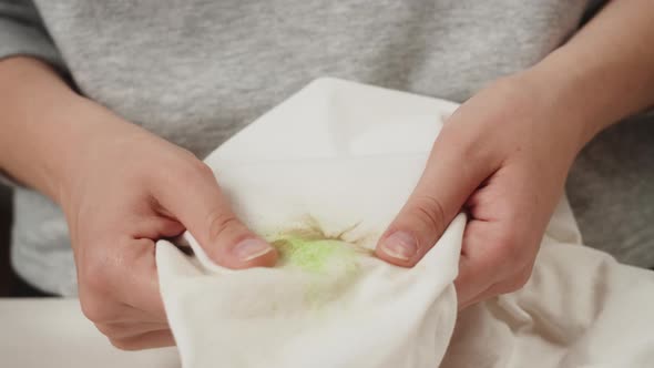 Woman Hands Rubbing Grass Stain on White Clothes Closeup Dirty Towel Trying to Wash By Hands