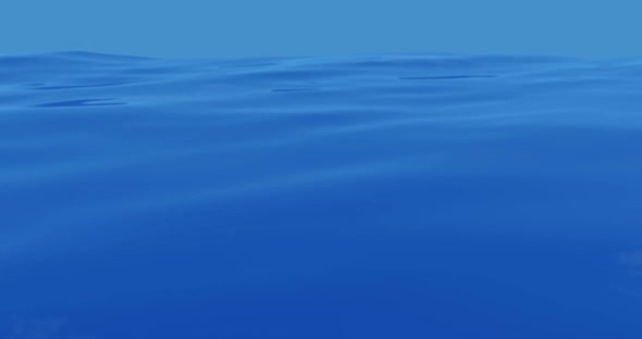 calm ocean with clear sky and sun rays on blue water alt