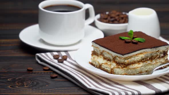 Portion of Traditional Italian Tiramisu Dessert Cup of Espresso Milk and Coffee Beans