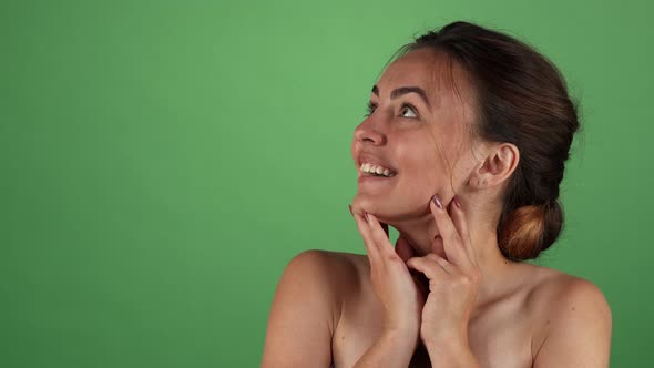 Attractive Woman Looking Surprised on Green Chromakey Background