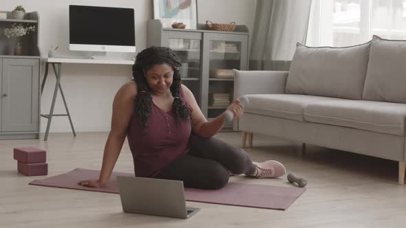 African Woman Having Online Training at Home