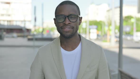 Portrait of Agree African Man Shaking Head in Approval Outdoor