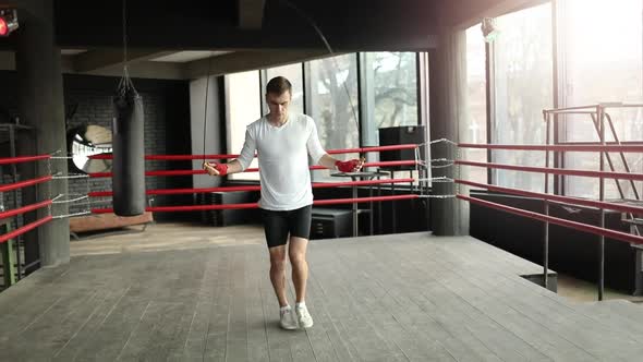 Boxer Man Training with a Jumping Rope