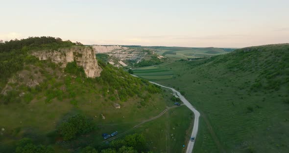 aerial shot of a quarry appears from behind a cliff, fetesti moldova