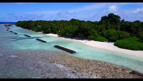 Aerial travel of tropical resort beach adventure by shallow ocean with white sand background of adve