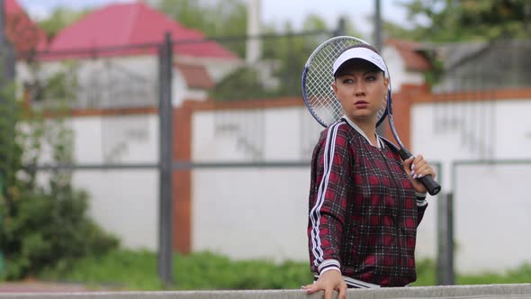 Seductive Confident Woman Playing Tennis on Court