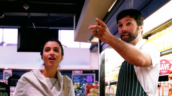 Male staff assisting costumer in shopping