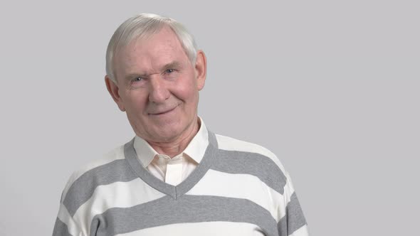 Cheerful Grandfather on Grey Background.