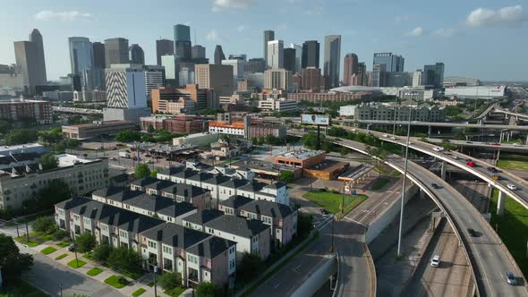 Houston Texas skyline. Residential homes and population growth theme. Aerial truck shot above inters