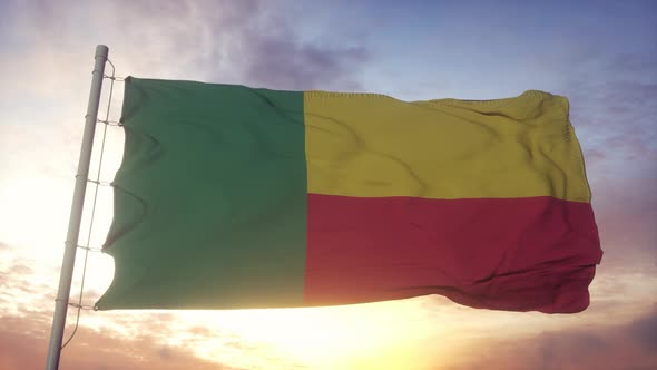 Flag of Benin Waving in the Wind Sky and Sun Background