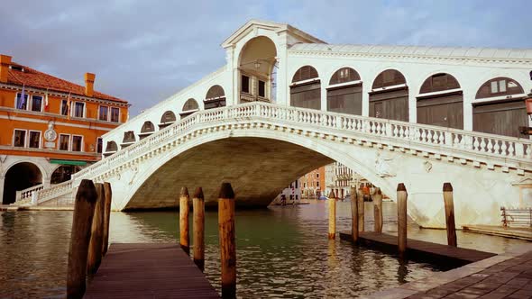 White Rialto Bridge with Arches and Pillars Over Channel