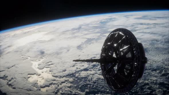 Futuristic Space Satellite Orbiting the Earth alt