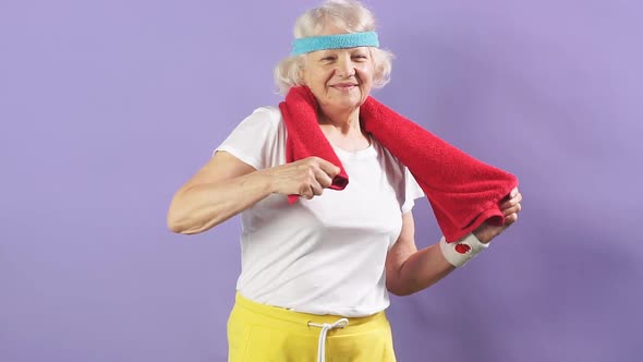 Healthy Active Retired Woman in Sportswear Looking at Camera with Beaming Face