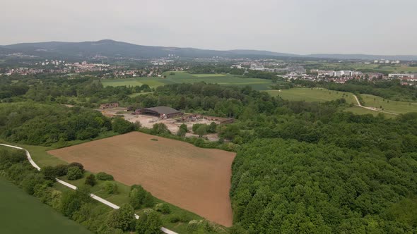 Aerial orbit around an abandoned military airfield on a cloudy spring day in Germany. Wide angle dro