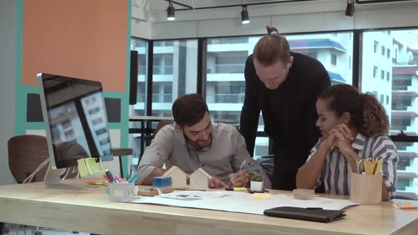 Creative Business People Group Having Conversation at Office Desk in Workplace