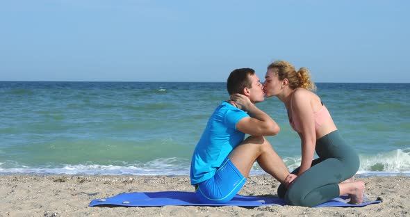 Sport Exercise and Love on the Ocean Beach