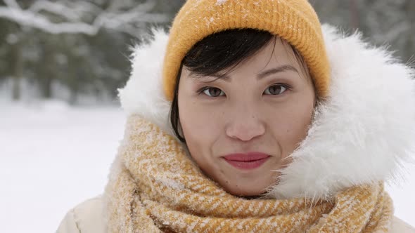 Asian Woman Posing in Winter Forest