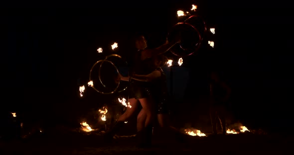 Slow Motion Professional Fire Performance Three Women with Torches and a Man with Flamethrowers