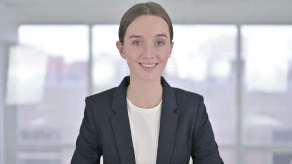 Portrait of Smiling Young Businesswoman Looking at the Camera