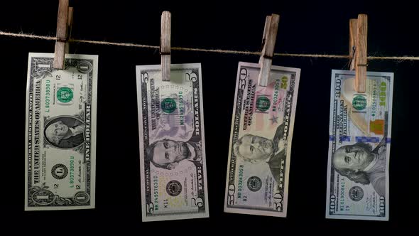 Dollars Dry on a Clothespin Rope