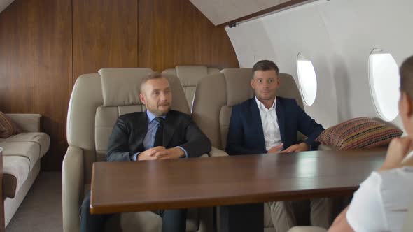 Premium View of Businesspeople Have Meeting in Corporate Jet