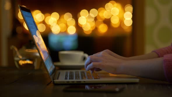 Female Hands Typing Text on Laptop