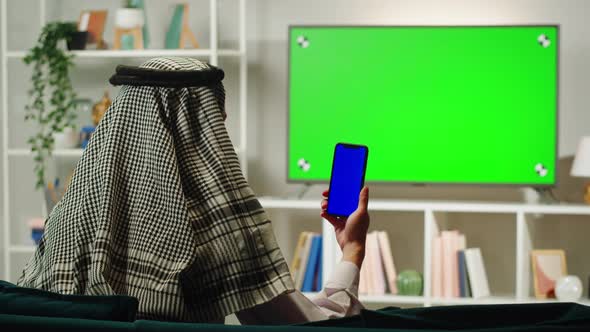 Middle Eastern Man Using Phone with Chroma Key Closeup