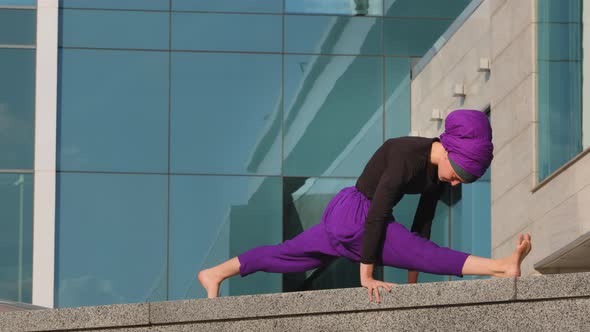 Strong Flexible Sports Muslim Young Girl Yogi Woman Doing Workout Exercises Practice in City Asana