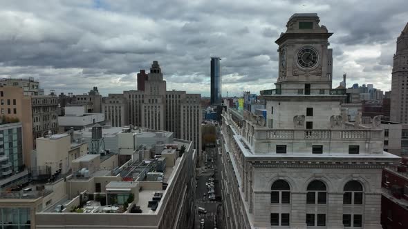 Forwards Fly High Above Street on Level of Multistorey Building Roof