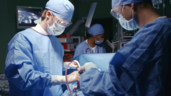 Surgeons in Scrubs Operating on Patient