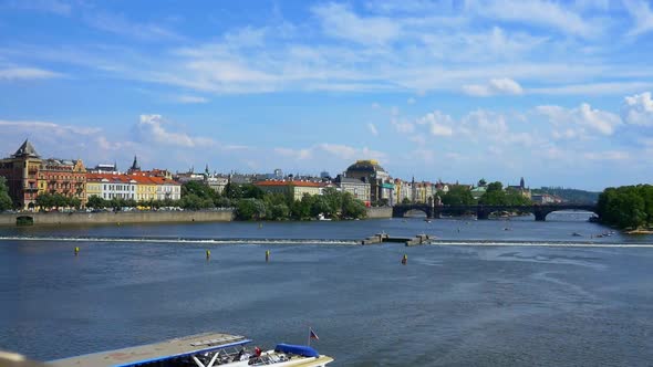 Panning view of Vltava River and Prague cityscape