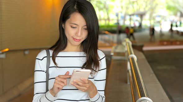 Woman use of mobile phone at outdoor